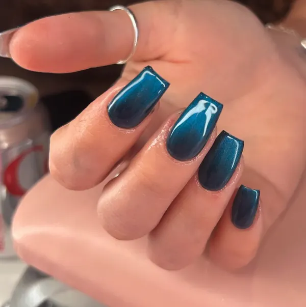 Square nails in a teal to black ombre with a cat-eye shimmer
