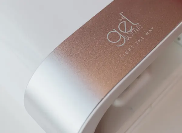 A The Gel Bottle curing lamp in rose gold and white at the Helston salon